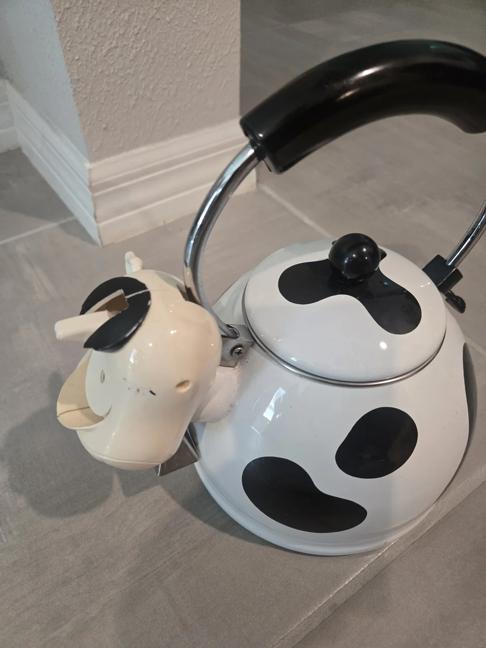 vintage M. Kamenstein black-and-white cow whistling tea kettle